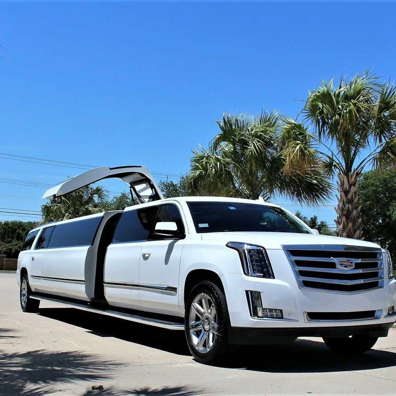 White Cadillac Escalade Limo with tinted windows for limo rental White Cadillac Escalade Limo with tinted windows for limo rental