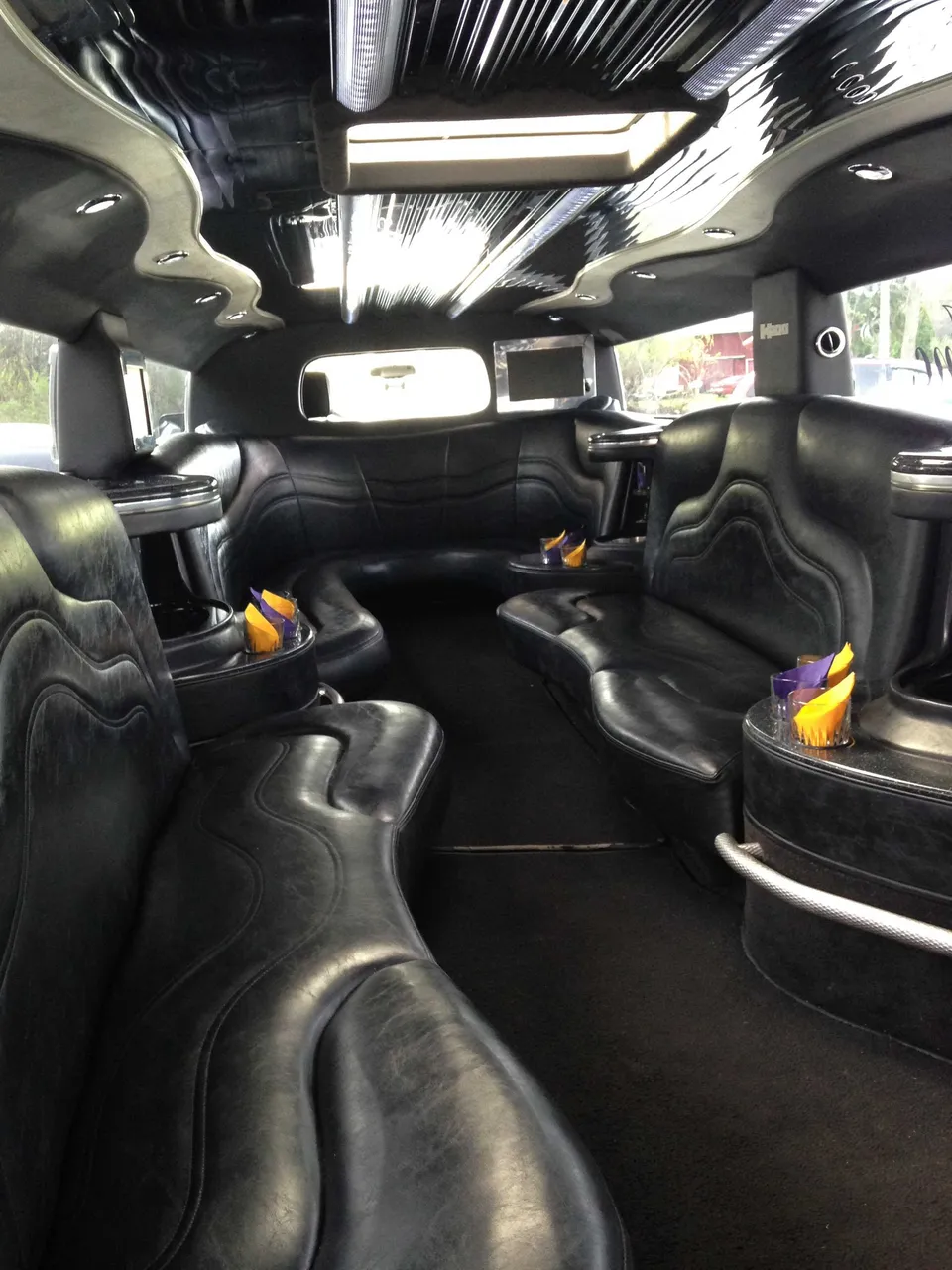 Hummer H2 Limousine - Elizabeth Taylor interior with perimeter lounge seating, photo 3 for limo rental Hummer H2 Limousine - Elizabeth Taylor interior with perimeter lounge seating, photo 3 for limo rental